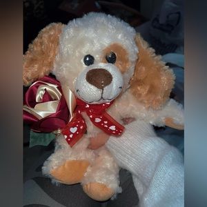 Puppy stuffed animal with rose